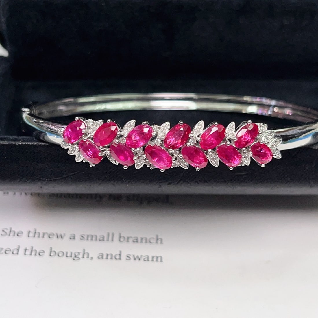 14k Gold 5.10 Ct Natural Ruby & Diamond Bangle: Ref:231144375 // gold content:14k gold // main gemstone:ruby // shape:oval // carat weight:5. 10ct // color:red // treatment:natural // // adjacent gemstone 2 : diamond // number of stones:50 //