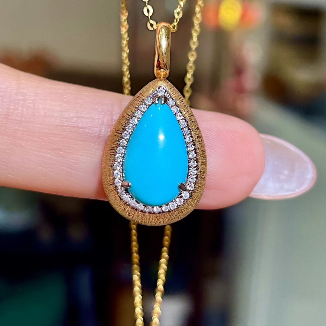 14k Gold 2.53 Ctw Natural Blue Turquoise & Diamond Pendant( Without Chain ): Ref:231144414 // gold content:14k gold // main gemstone:blue turquoise // shape:pear // carat weight:2. 43ct // color:blue // treatment:natural // // adjacent gemstone 2 : diamond // shape:round //