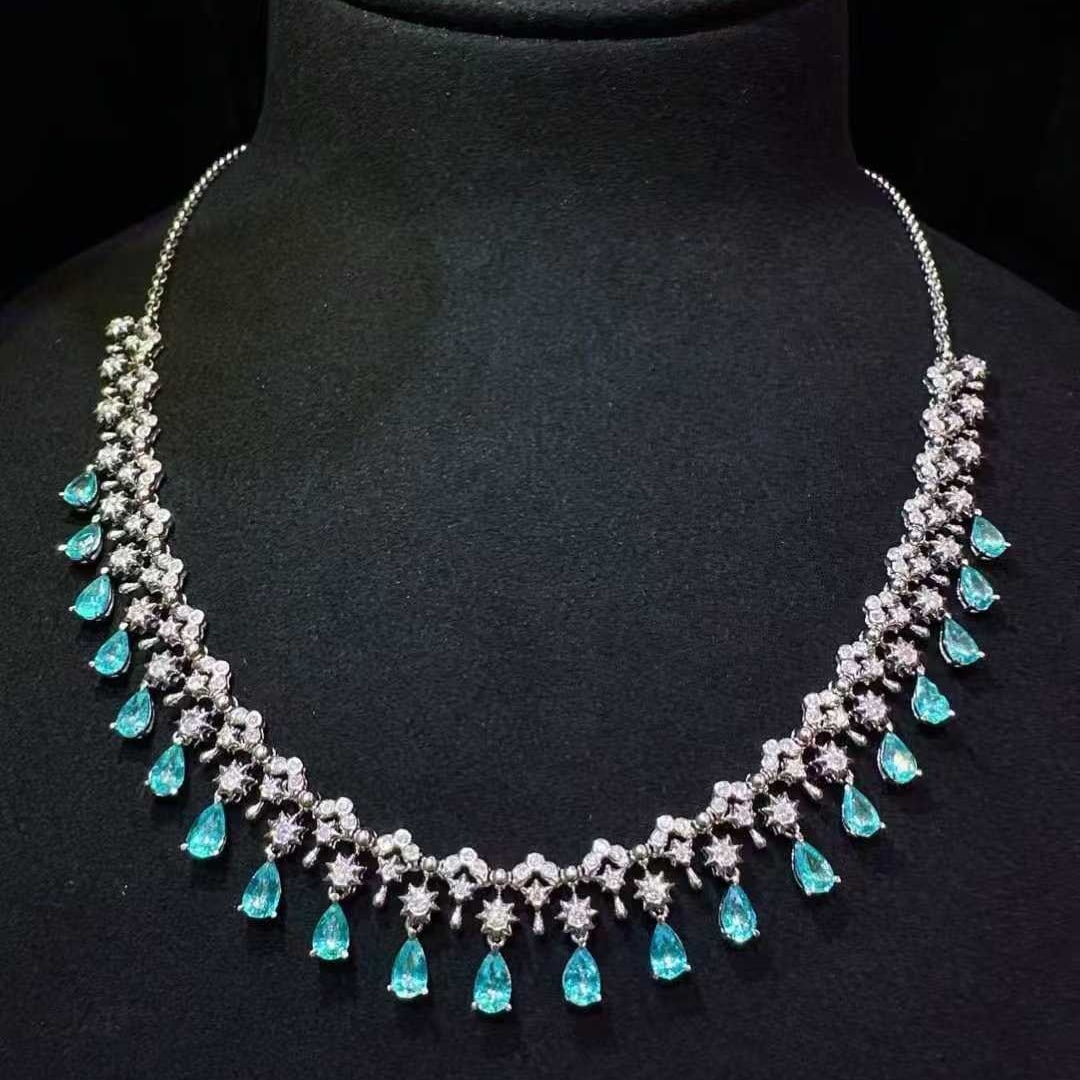 14k Gold 4.86 Ctw Natural Paraiba Tourmaline & Diamond Necklace: Ref:231135017 // gold content:14k gold // main gemstone:paraiba tourmaline // shape:pear // carat weight:3. 65ct // color:blue // treatment:natural // // adjacent gemstone 2 : diamond //