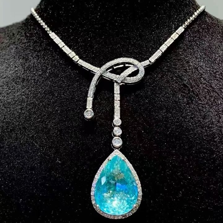 14k Gold 8.54 Ct Natural Paraiba Tourmaline & Diamond Necklace: Ref:231135060 // gold content:14k gold // main gemstone:paraiba tourmaline // shape:pear // carat weight:8. 54ct // color:blue // treatment:natural // // adjacent gemstone 2 : diamond // shape:round /