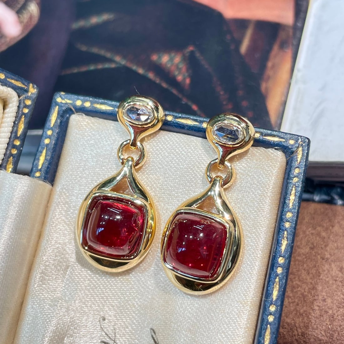 14k Gold 6.23 Ct Natural Tourmaline Earrings: Ref:231136178 // gold content:14k gold // main gemstone:tourmaline // shape:sugar-loaf // carat weight:6. 23ct // color:red // treatment:natural // High Estimate: 6300Condition: NewLow Estimate: 4200