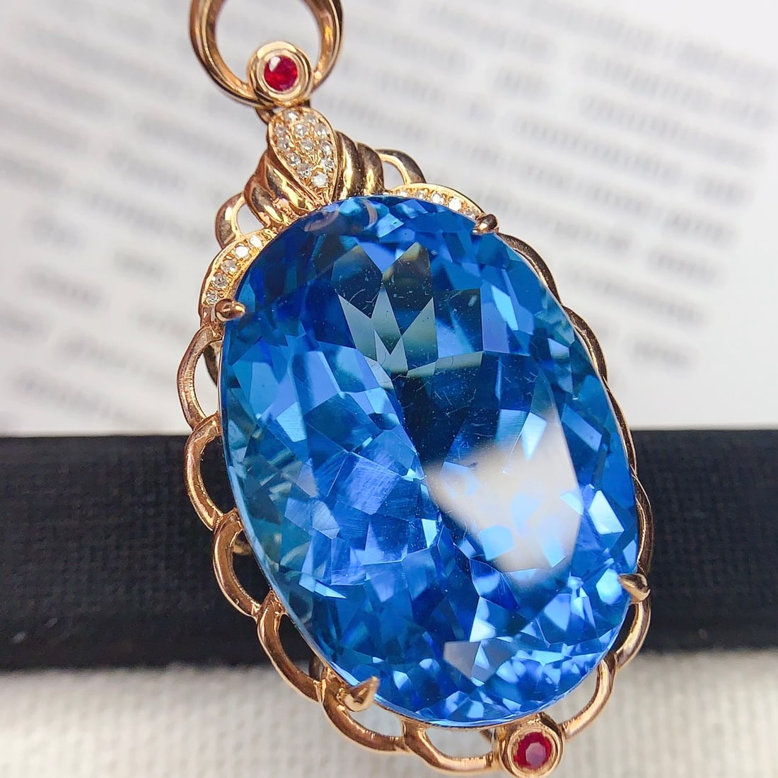 14k Gold 33 Ct Natural Topaz & Diamond & Ruby Pendant( Without Chain ): Ref:231136394 // gold content:14k gold // main gemstone:topaz // shape:oval // carat weight:33ct // color:blue // treatment:natural // // adjacent gemstone 2 : diamond // number of stones:22 //