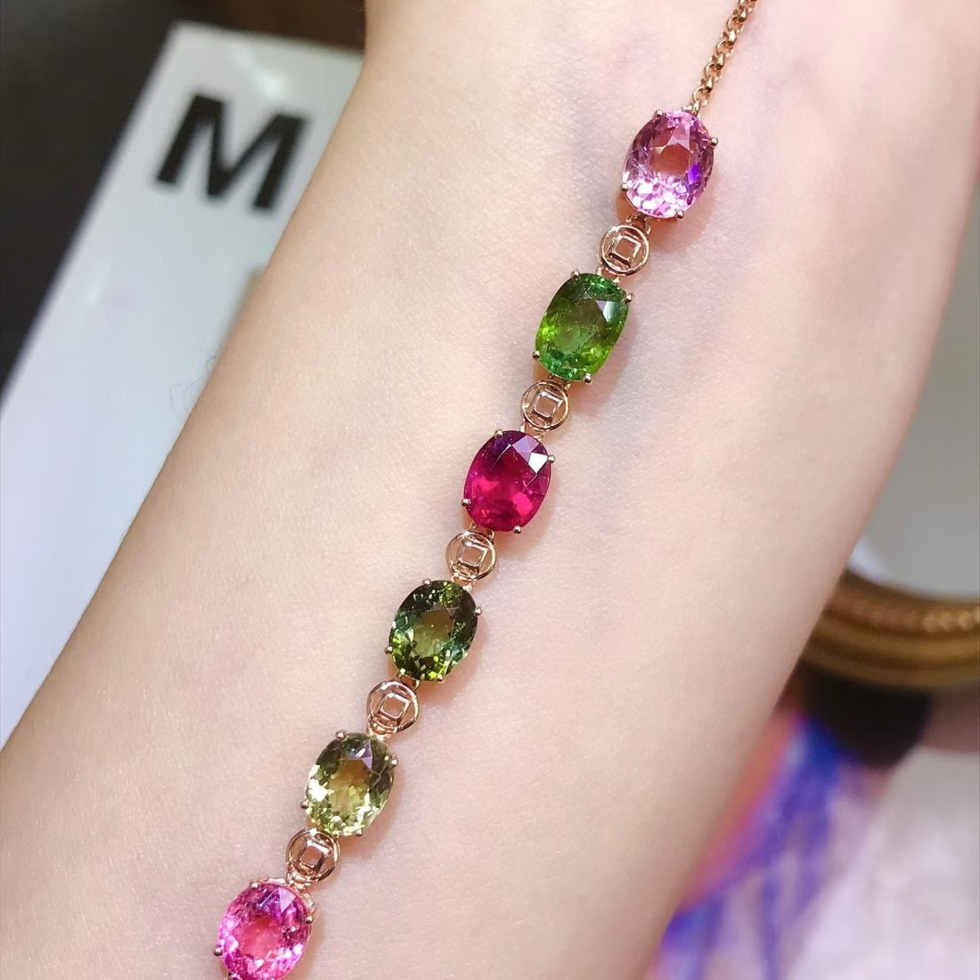 14k Gold 7.2 Ct Natural Tourmaline Bracelet: Ref:231121019 // gold content:14k gold // main gemstone:tourmaline // shape:oval // carat weight:7. 2ct // color:color // treatment:natural // Condition: New Low Estimate: 4500.00 High Estimate: 6800