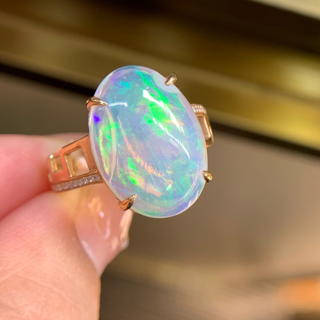 14k Gold 7.1 Ct Natural Opal & Diamond Ring: Ref:231121043 // gold content:14k gold // ring size:7. 25us // // main gemstone:opal // shape:oval // carat weight:7. 1ct // color:color // treatment:natural // // adjacent gemstone 2 : diamond // sha