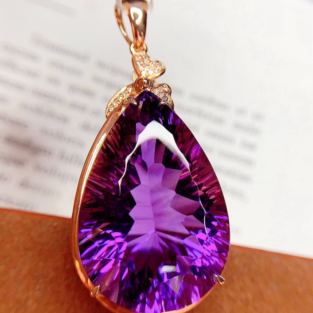 14k Gold 39.35 Ct Natural Amethyst & Diamond Pendant( Without Chain ): Ref:231121099 // gold content:14k gold // main gemstone:amethyst // shape:pear // carat weight:39. 35ct // color:purple // treatment:natural // // adjacent gemstone 2 : diamond // number of stones:20