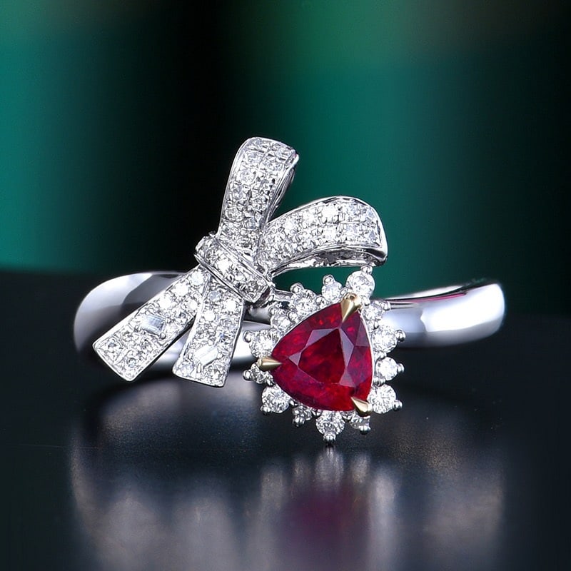 14k Gold 0.82 Ctw Vivid Red Natural Ruby & Diamond Ring: Ref:231122035 // gold content:14k gold // ring size:7. 25us // // main gemstone:ruby // shape:pear // carat weight:0. 57ct // color:vivid red // treatment:natural // // adjacent gemstone 2 : diamond /