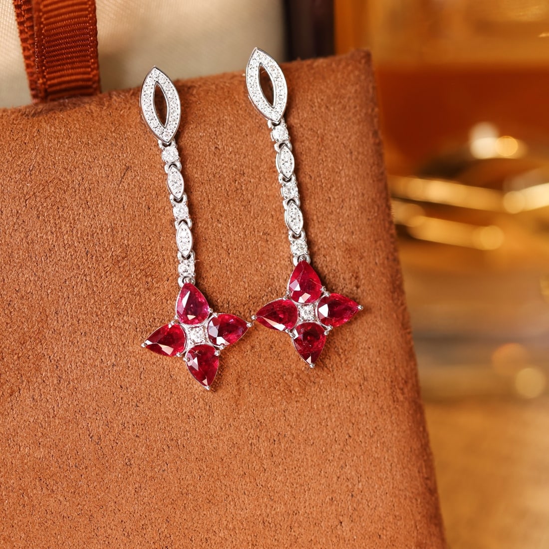 14k Gold 2.45 Ctw Natural Ruby & Diamond Earrings: Ref:231122065 // gold content:14k gold // main gemstone:ruby // shape:pear // carat weight:2. 15ct // color:red // treatment:natural // // adjacent gemstone 2 : diamond // shape:round // carat weight: