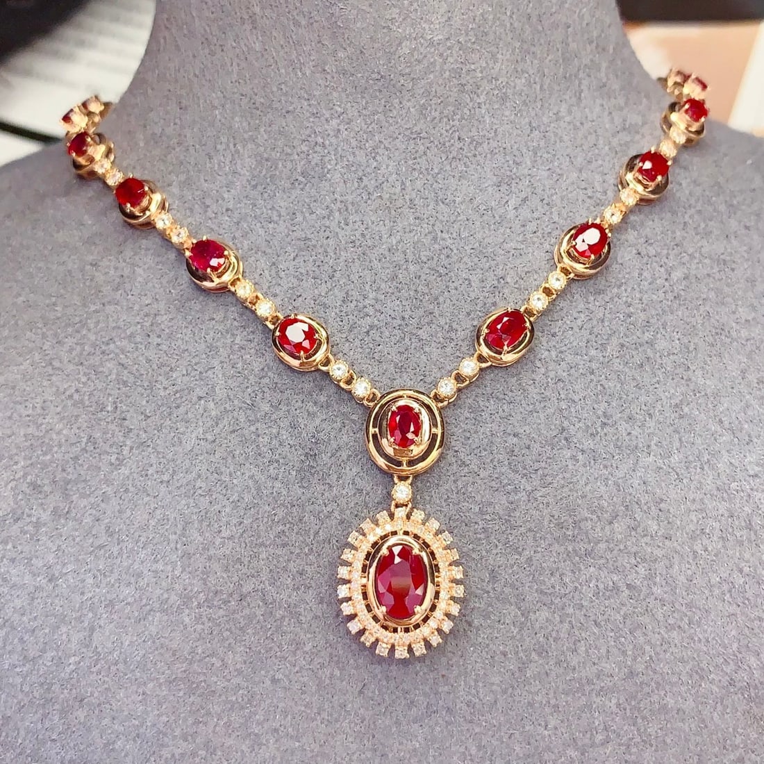 14k Gold 6.3 Ct Vivid Red Natural Ruby & Diamond & Sapphire Necklace: Ref:231122075 // gold content:14k gold // main gemstone:ruby // shape:oval // carat weight:6. 3ct // color:vivid red // treatment:natural // // adjacent gemstone 2 : diamond // number of stones:54 //