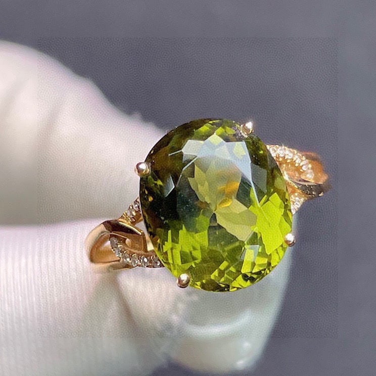 14k Gold 6.2 Ct Natural Tourmaline & Diamond Ring: Ref:231122118 // gold content:14k gold // ring size:7. 25us // // main gemstone:tourmaline // shape:oval // carat weight:6. 2ct // color:green // treatment:natural // // adjacent gemstone 2 : diamond