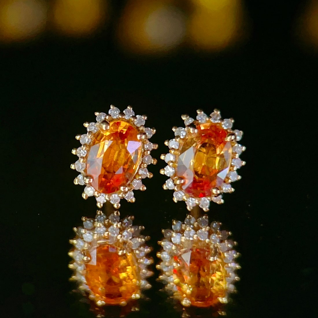 14k Gold 1.33 Ctw Natural Sapphire & Diamond Earrings: Ref:231122119 // gold content:14k gold // main gemstone:sapphire // shape:oval // carat weight:1. 15ct // color:orange // treatment:natural // // adjacent gemstone 2 : diamond // number of stones:36 /