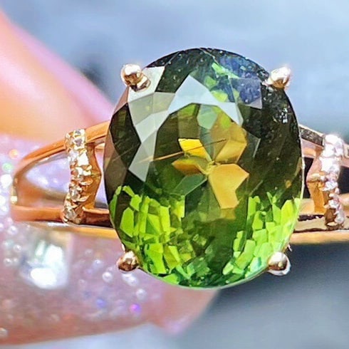 14k Gold 5.93 Ct Natural Tourmaline & Diamond Ring: Ref:231122140 // gold content:14k gold // ring size:7. 25us // // main gemstone:tourmaline // shape:oval // carat weight:5. 93ct // color:green // treatment:natural // // adjacent gemstone 2 : diamond