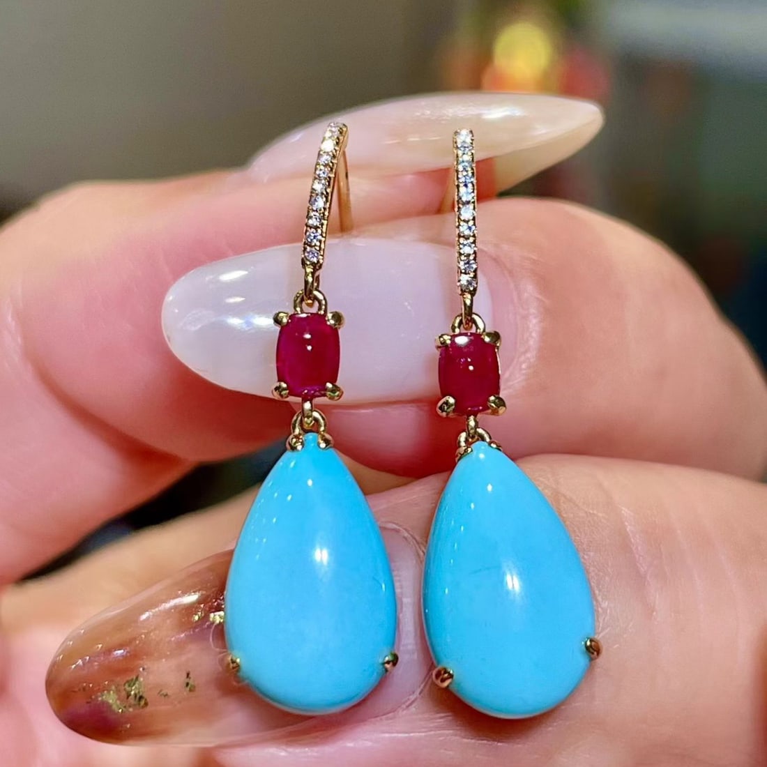 14k Gold 5.41 Ctw Natural Blue Turquoise & Ruby Earrings: Ref:231122169 // gold content:14k gold // main gemstone:blue turquoise // shape:pear // carat weight:4. 98ct // color:blue // treatment:natural // // adjacent gemstone 2 : ruby // shape:oval // carat