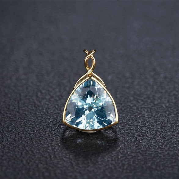 14k Gold 4.48 Ct Natural Aquamarine Pendant( Without Chain ): Ref:231122233 // gold content:14k gold // main gemstone:aquamarine // shape:triangle // carat weight:4. 48ct // color:santa maria color // treatment:natural // High Estimate: 5300 Low Estimate: 3500
