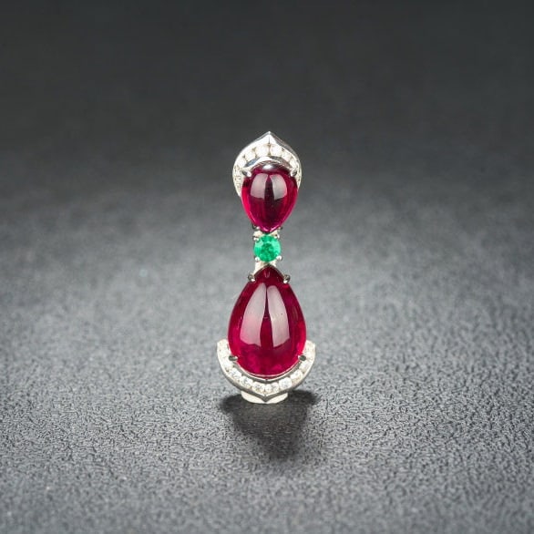 14k Gold 17.60 Ctw Natural Tourmaline & Diamond Pendant( Without Chain ): Ref:231122237 // gold content:14k gold // main gemstone:tourmaline // shape:pear // carat weight:17. 13ct // color:red // treatment:natural // // adjacent gemstone 2 : diamond // shape:round //