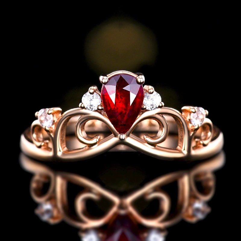 14k Gold 0.49 Ct Natural Ruby & Sapphire Ring: Ref:231122243 // gold content:14k gold // ring size:7. 25us // // main gemstone:ruby // shape:pear // carat weight:0. 49ct // color:pigeonblood red // treatment:natural // // adjacent gemstone 2 :