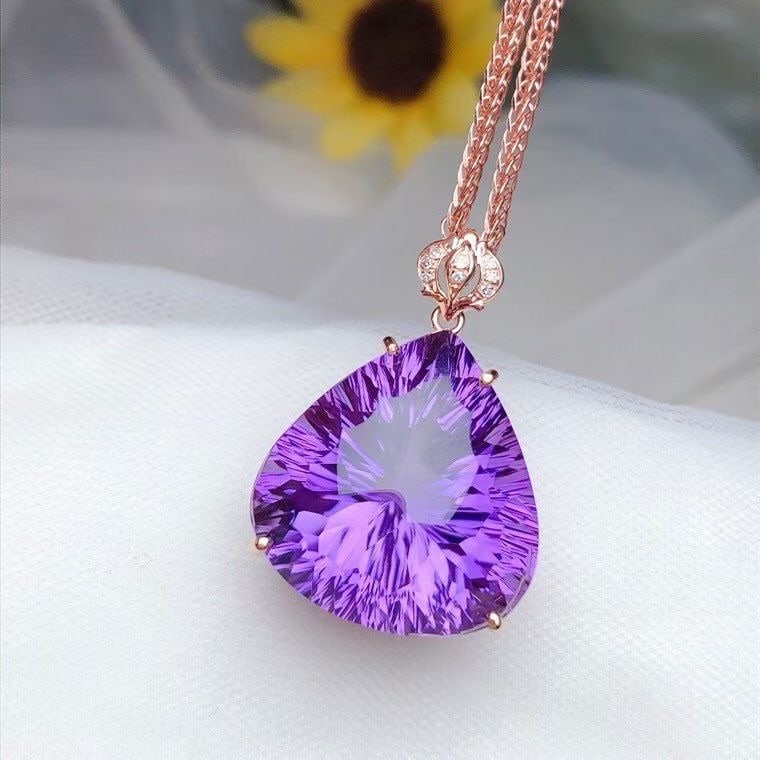 14k Gold 21.00 Ct Natural Amethyst & Diamond Pendant( Without Chain ): Ref:231122284 // gold content:14k gold // main gemstone:amethyst // shape:pear // carat weight:21. 00ct // color:purple // treatment:natural // // adjacent gemstone 2 : diamond // number of stones:8 /