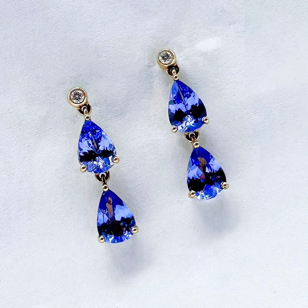 14k Gold 2 Ct Natural Tanzanite & Diamond Earrings: Ref:231122290 // gold content:14k gold // main gemstone:tanzanite // shape:pear // carat weight:2ct // color:blue // treatment:natural // // adjacent gemstone 2 : diamond // number of stones:2 // shap