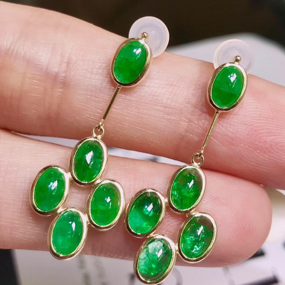 14k Gold 4.6 Ct Natural Emerald Earrings: Ref:231122322 // gold content:14k gold // main gemstone:emerald // shape:oval // carat weight:4. 6ct // color:green // treatment:natural // Condition: New Low Estimate: 3800.00 High Estimate: 5600.00