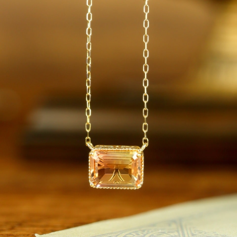 14k Gold 1.75 Ctw Natural Tourmaline & Diamond Necklace: Ref:231122339 // gold content:14k gold // main gemstone:tourmaline // shape:octagonal // carat weight:1. 65ct // color:orange // treatment:natural // // adjacent gemstone 2 : diamond // shape:round