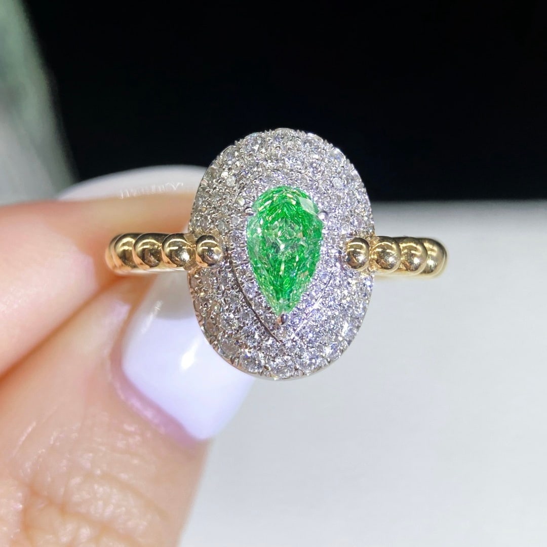 14k Gold 1.02 Ctw Natural Green Diamond & Diamond Ring: Ref:231122356 // gold content:14k gold // ring size:7. 25us // // main gemstone:green diamond // shape:pear // carat weight:0. 57ct // color:green // treatment:natural // // adjacent gemstone 2 : diam
