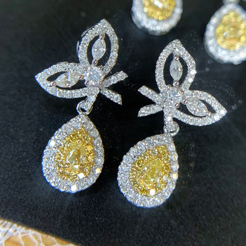 14k Gold 0.90 Ct Natural Color Diamond Earrings: Ref:231141132 // gold content:14k gold // main gemstone:diamond // shape:multiple // carat weight:0. 90ct // clarity grade:vs-si // color:color // treatment:natural // Condition: NewLow Estimate: