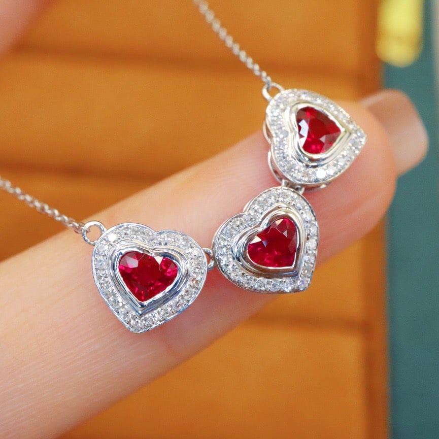 14k Gold 1.35 Ctw Natural Ruby & Diamond Necklace: Ref:231142420 // gold content:14k gold // main gemstone:ruby // shape:heart // carat weight:1. 05ct // color:red // treatment:natural // // adjacent gemstone 2 : diamond // number of stones:60 //