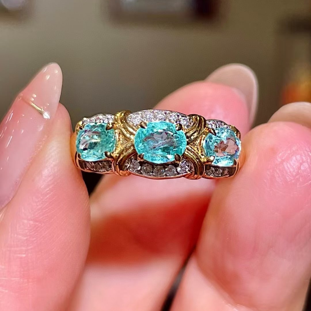 14k Gold 1.34 Ctw Natural Paraiba Tourmaline & Diamond Ring: Ref:230968042 // gold content:14k gold // ring size:7. 25us // // main gemstone:paraiba tourmaline // shape:oval // carat weight:1. 23ct // color:blue // treatment:natural // // adjacent gemstone 2 :