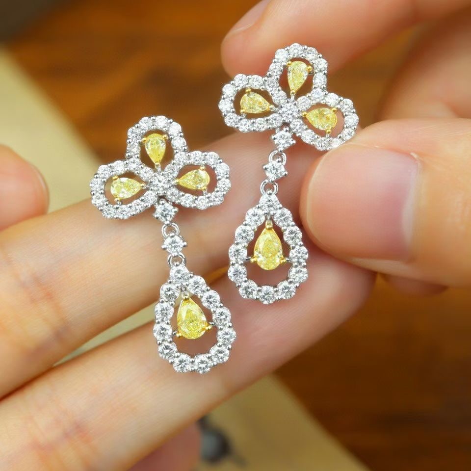 14k Gold 2.55 Ctw Natural Yellow Diamond & Diamond Earrings: Ref:230968423 // gold content:14k gold // main gemstone:yellow diamond // shape:pear // carat weight:0. 85ct // color:yellow // treatment:natural // // adjacent gemstone 2 : diamond // shape:round // 