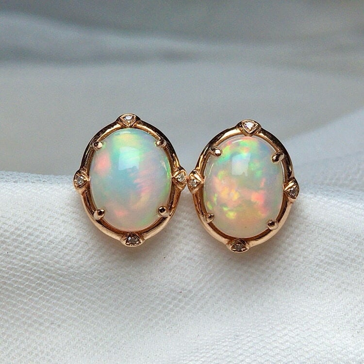 14k Gold 4.00 Ct Natural Opal & Diamond Earrings: Ref:231137098 // gold content:14k gold // main gemstone:opal // shape:oval // carat weight:4. 00ct // color:color // treatment:natural // // adjacent gemstone 2 : diamond // number of stones:8 //