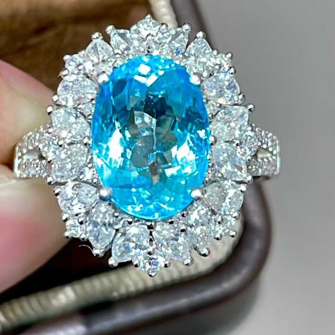 14k Gold 4.85 Ctw Natural Paraiba Tourmaline & Diamond Ring: Ref:231137100 // gold content:14k gold // ring size:7. 25us // // main gemstone:paraiba tourmaline // shape:oval // carat weight:3. 55ct // color:neon blue // treatment:natural // // adjacent gemstone