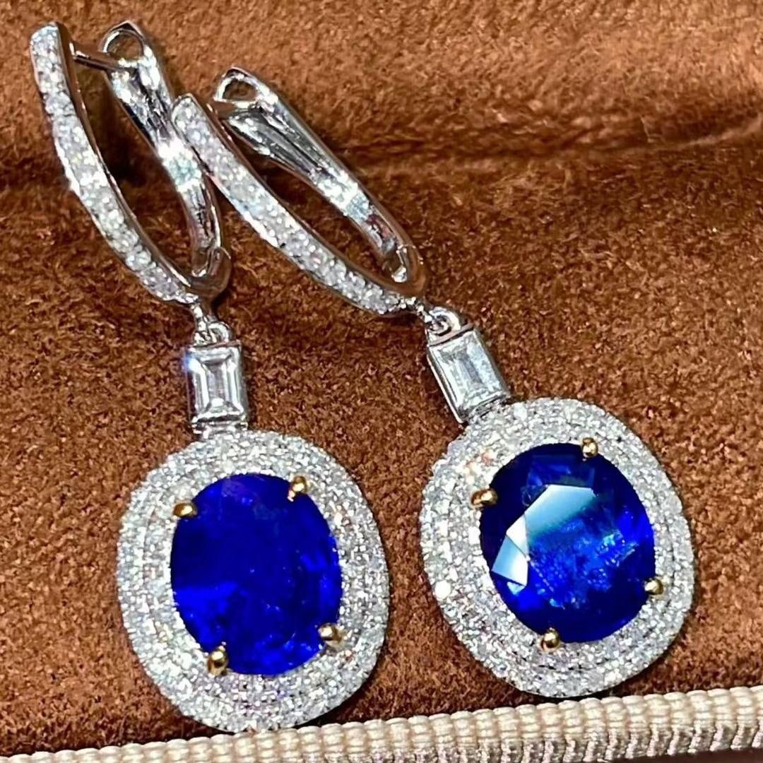 14k Gold 3.27 Ctw Natural Sapphire & Diamond Earrings: Ref:231137133 // gold content:14k gold // main gemstone:sapphire // shape:oval // carat weight:2. 82ct // color:blue // treatment:natural // // adjacent gemstone 2 : diamond // shape:round // carat