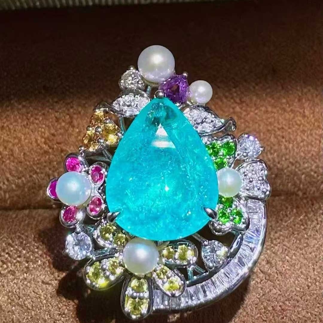 14k Gold 2.59 Ctw Natural Paraiba Tourmaline & Diamond Ring: Ref:231137147 // gold content:14k gold // ring size:7. 25us // // main gemstone:paraiba tourmaline // shape:pear // carat weight:2. 25ct // color:blue // treatment:natural // // adjacent gemstone