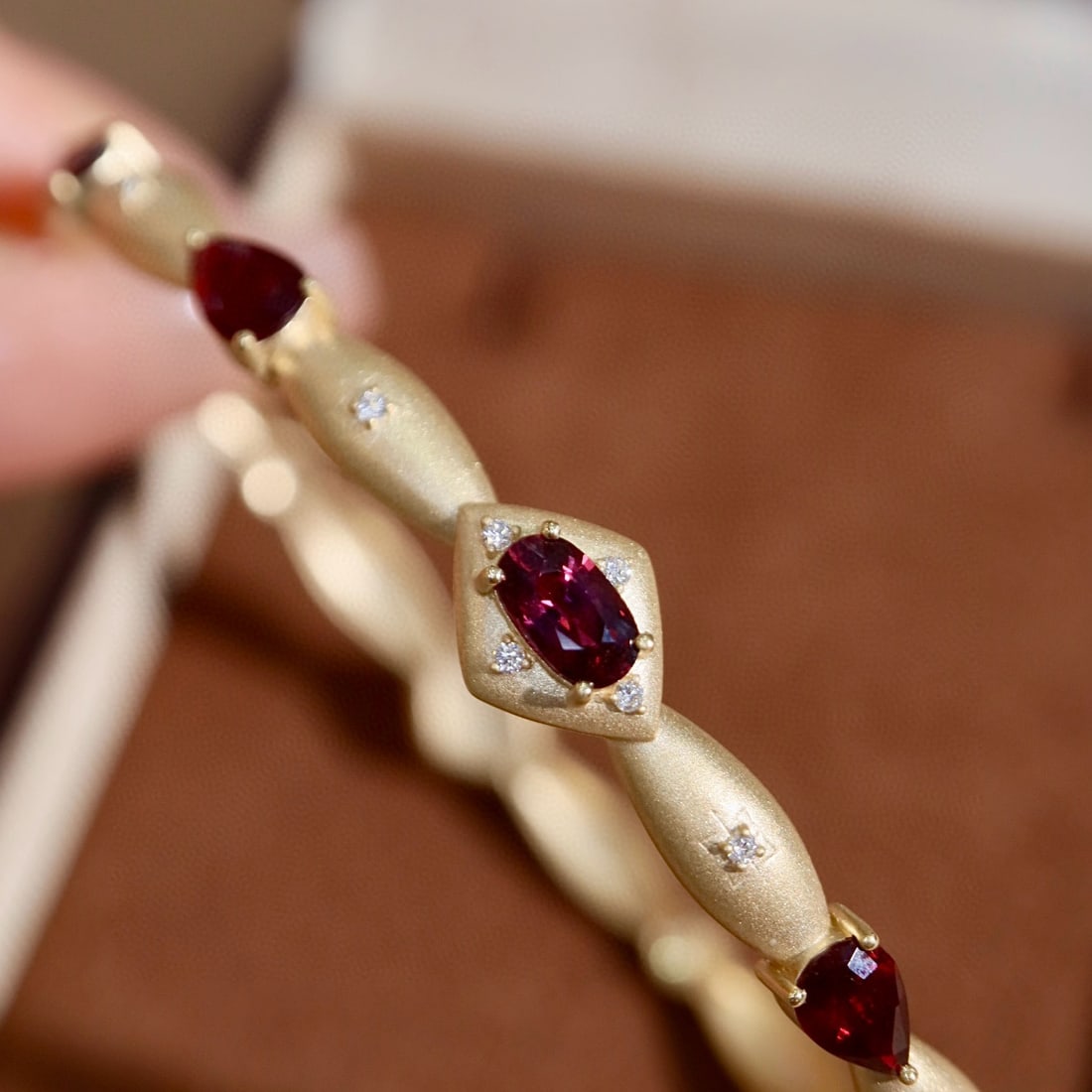 14k Gold 2.39 Ctw Natural Ruby & Diamond Bangle: Ref:231137219 // gold content:14k gold // main gemstone:ruby // shape:multiple // carat weight:2. 32ct // color:red // treatment:natural // // adjacent gemstone 2 : diamond // shape:round // carat wei