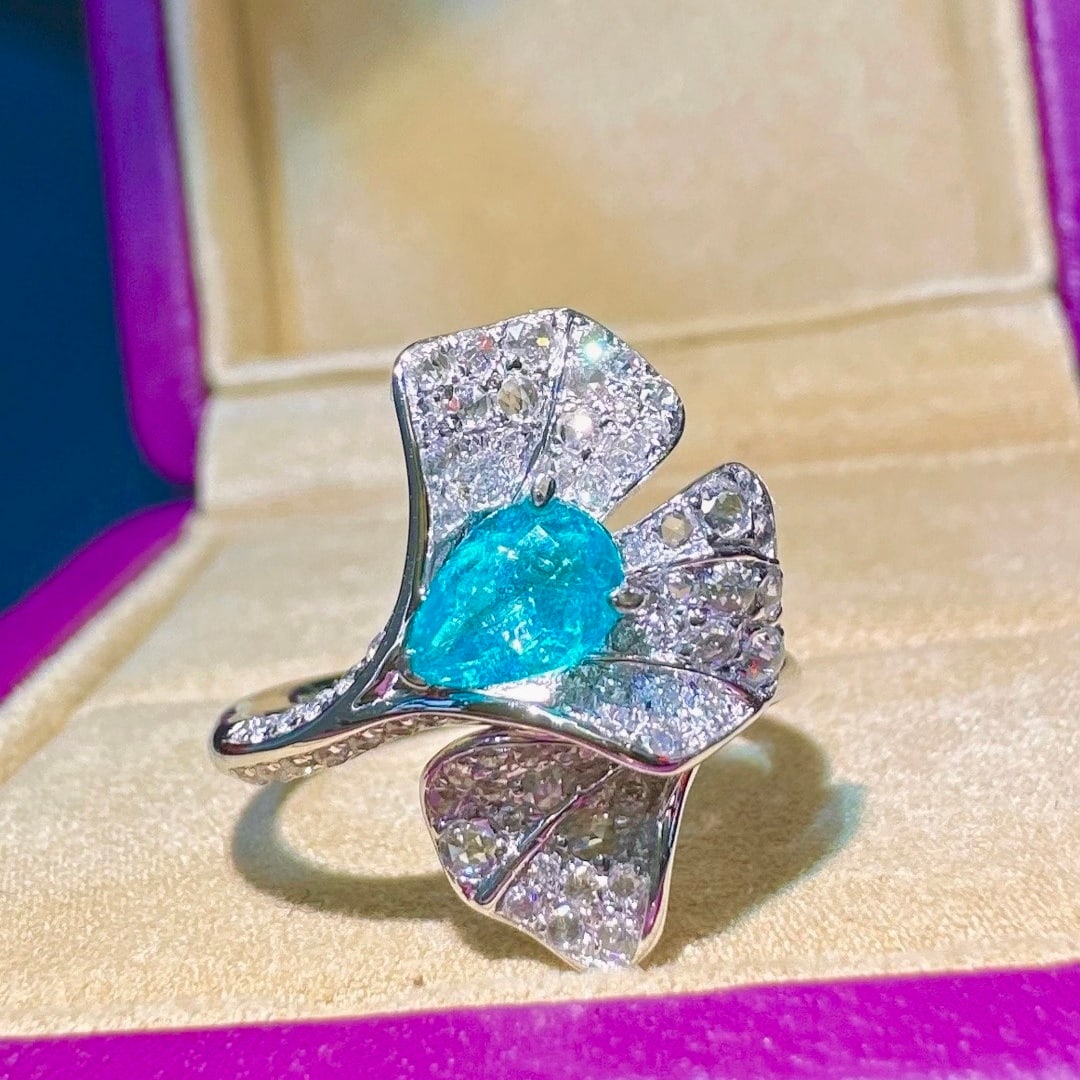 14k Gold 0.92 Ctw Natural Paraiba Tourmaline & Diamond Ring: Ref:231138175 // gold content:14k gold // ring size:7. 25us // // main gemstone:paraiba tourmaline // shape:pear // carat weight:0. 47ct // color:blue // treatment:natural // // adjacent gemstone