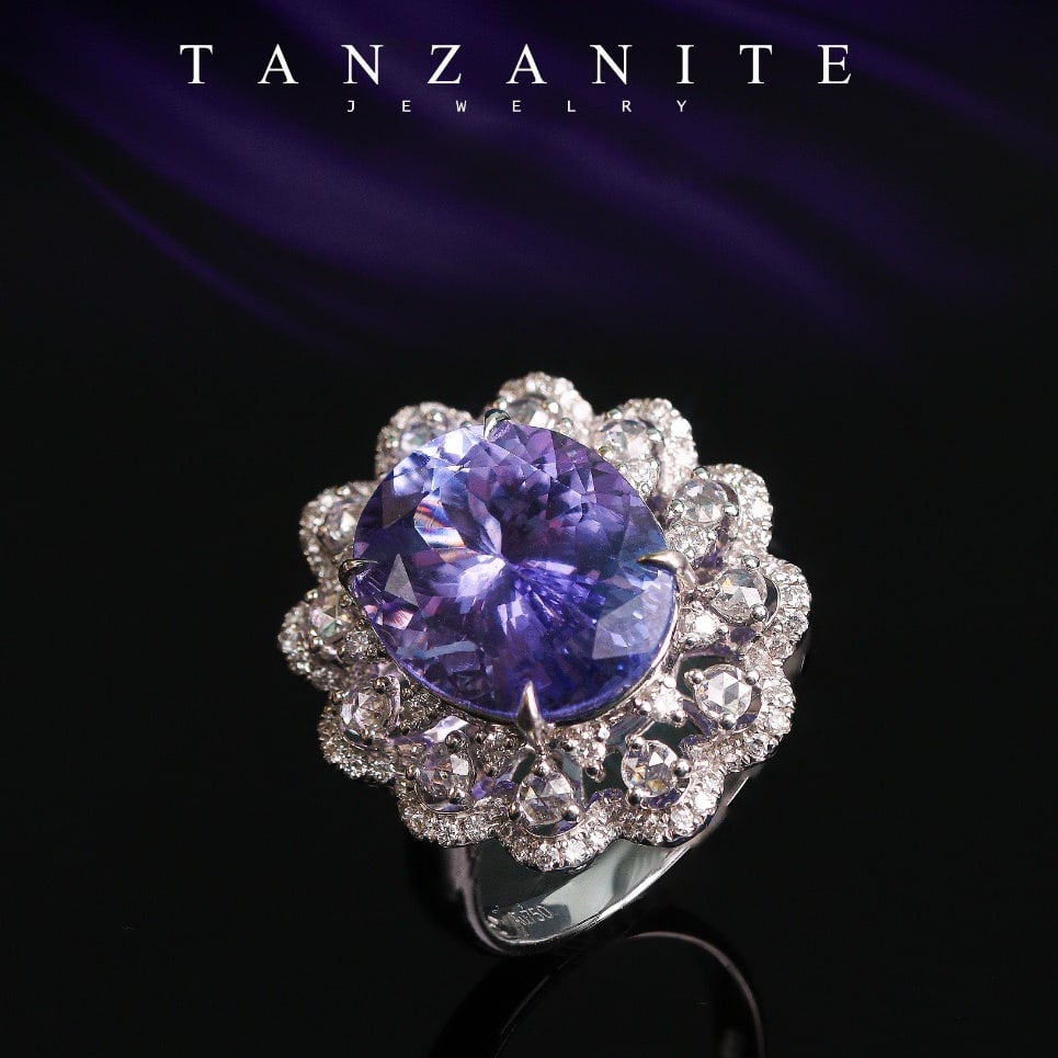 14k Gold 7.56 Ctw Natural Tanzanite & Diamond Ring: Ref:231138343 // gold content:14k gold // ring size:7. 25us // // main gemstone:tanzanite // shape:oval // carat weight:6. 83ct // color:bluish purple // treatment:natural // // adjacent gemstone 2 :