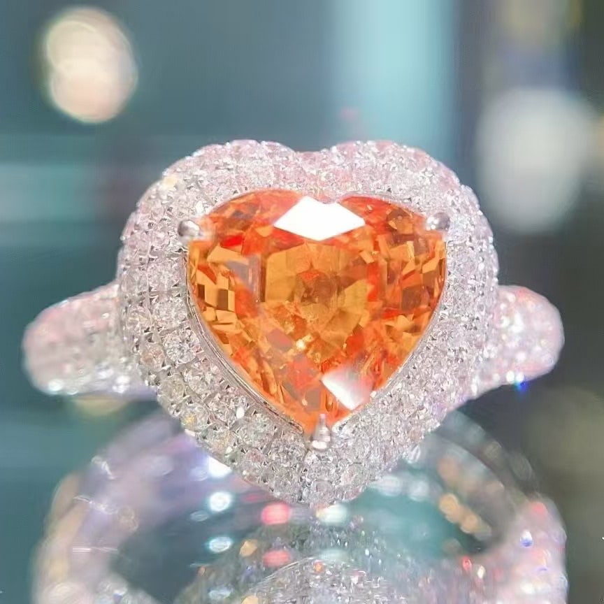 14k Gold 4.52 Ctw Natural Spessartine & Diamond Ring: Ref:230949125 // gold content:14k gold // ring size:7. 25us // // main gemstone:spessartine // shape:heart // carat weight:3. 35ct // color:orange // treatment:natural // // adjacent gemstone 2 : diam