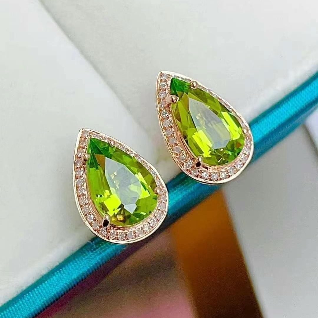 14k Gold 2.52 Ct Natural Tourmaline & Diamond Earrings: Ref:230949155 // gold content:14k gold // main gemstone:tourmaline // shape:pear // carat weight:2. 52ct // color:green // treatment:natural // // adjacent gemstone 2 : diamond // shape:round //