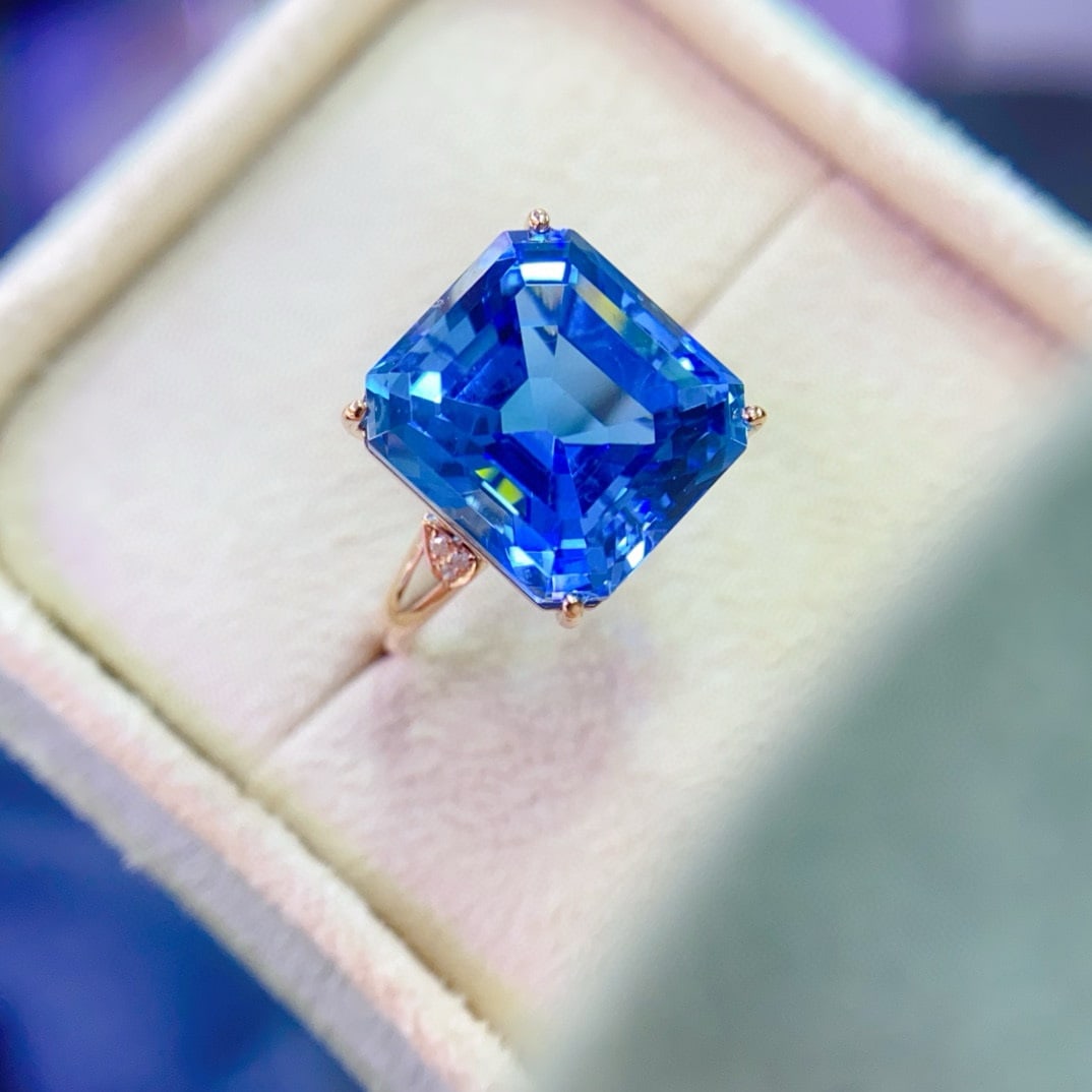 14k Gold 11.57 Ctw Natural Topaz & Diamond Ring: Ref:230950046 // gold content:14k gold // ring size:7. 25us // // main gemstone:topaz // shape:octagonal // carat weight:11. 55ct // color:swiss blue // treatment:natural // // adjacent gemstone 2