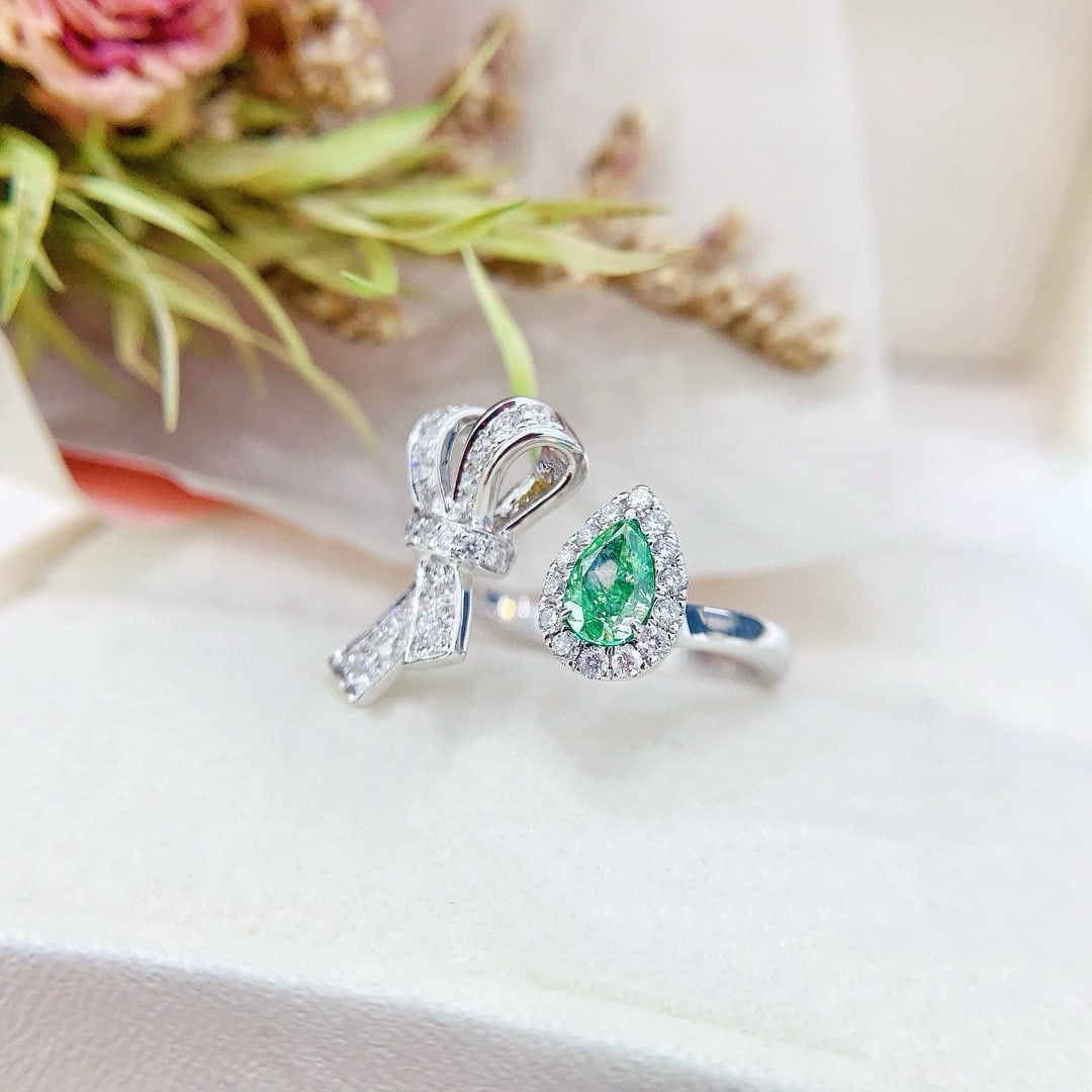 14k Gold 0.93 Ctw Natural Green Diamond & Diamond Ring: Ref:230950065 // gold content:14k gold // ring size:7. 25us // // main gemstone:green diamond // shape:pear // carat weight:0. 51ct // color:green // treatment:natural // // adjacent gemstone 2 :