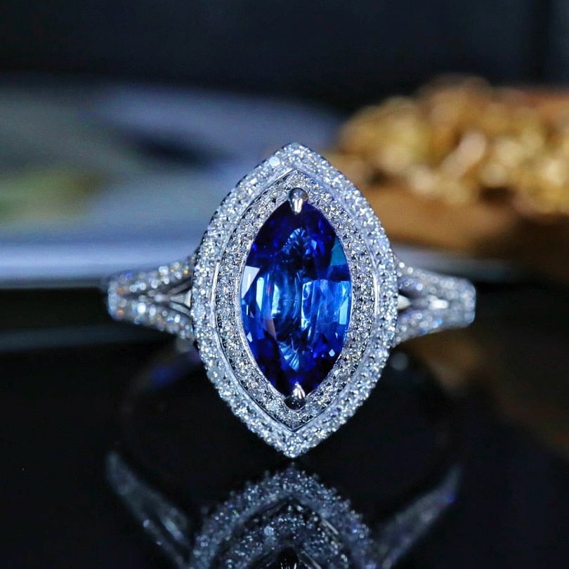 14k Gold 1.51 Ctw Natural Sapphire & Diamond Ring: Ref:230950212 // gold content:14k gold // ring size:7. 25us // // main gemstone:sapphire // shape:marquise // carat weight:1. 23ct // color:royal blue // treatment:natural // // adjacent gemstone