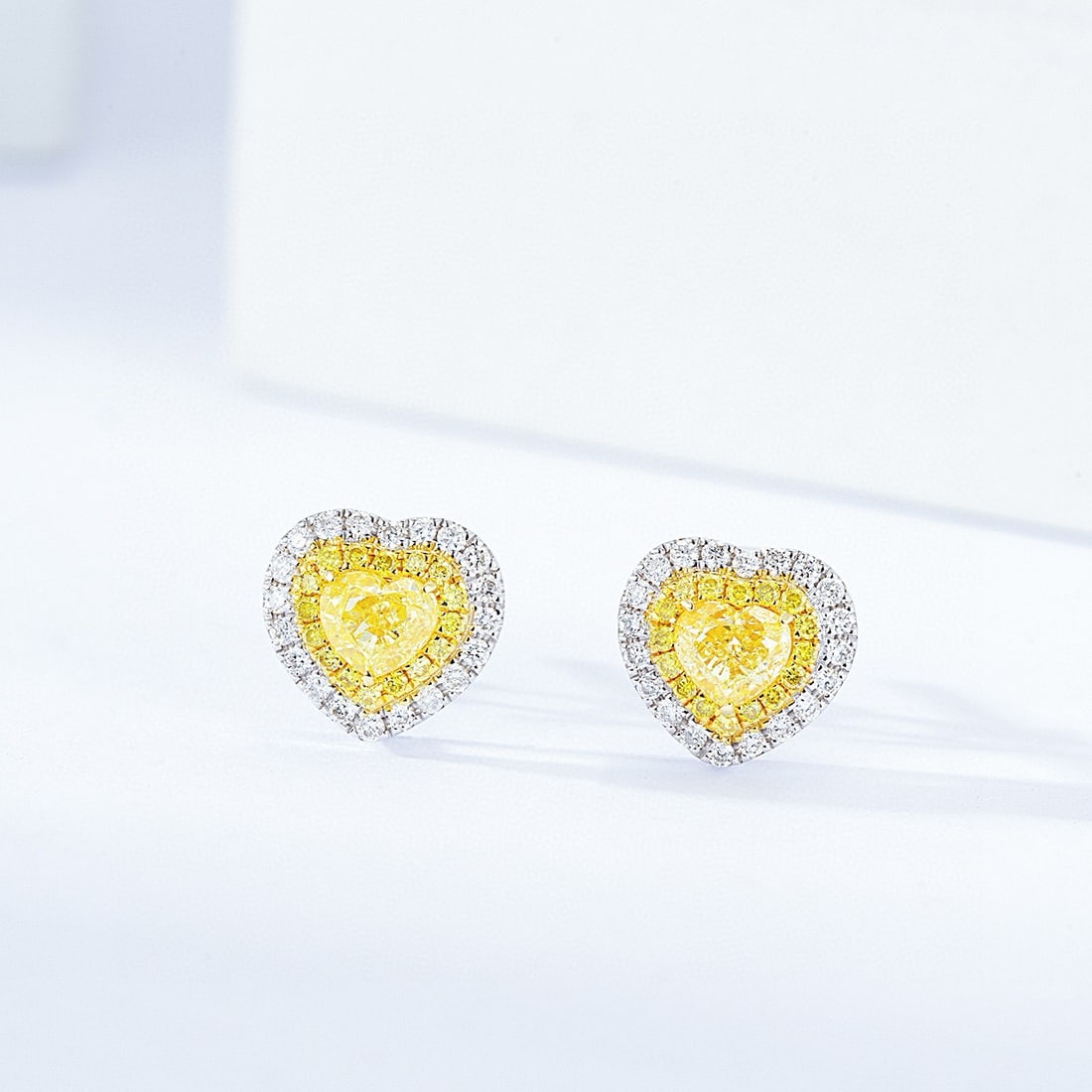 14k Gold 0.68 Ctw Natural Yellow Diamond & Diamond Earrings: Ref:230950315 // gold content:14k gold // main gemstone:yellow diamond // shape:heart // carat weight:0. 42ct // color:yellow // treatment:natural // // adjacent gemstone 2 : diamond // shape:round