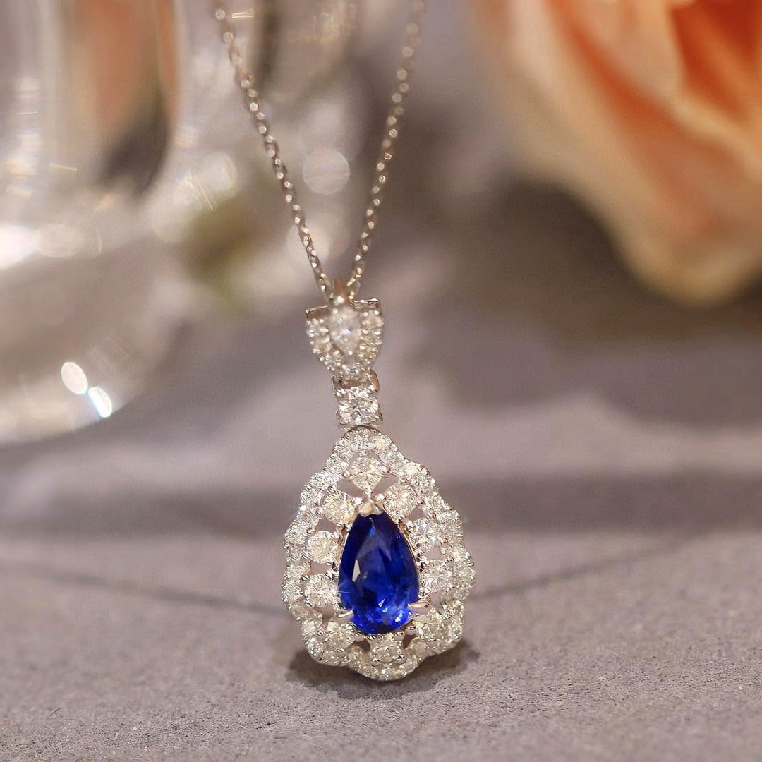 14k Gold 1.54 Ctw Natural Sapphire & Diamond Pendant( Without Chain ): Ref:230950426 // gold content:14k gold // main gemstone:sapphire // shape:pear // carat weight:1. 01ct // color:royal blue // treatment:natural // // adjacent gemstone 2 : diamond // shape:multiply