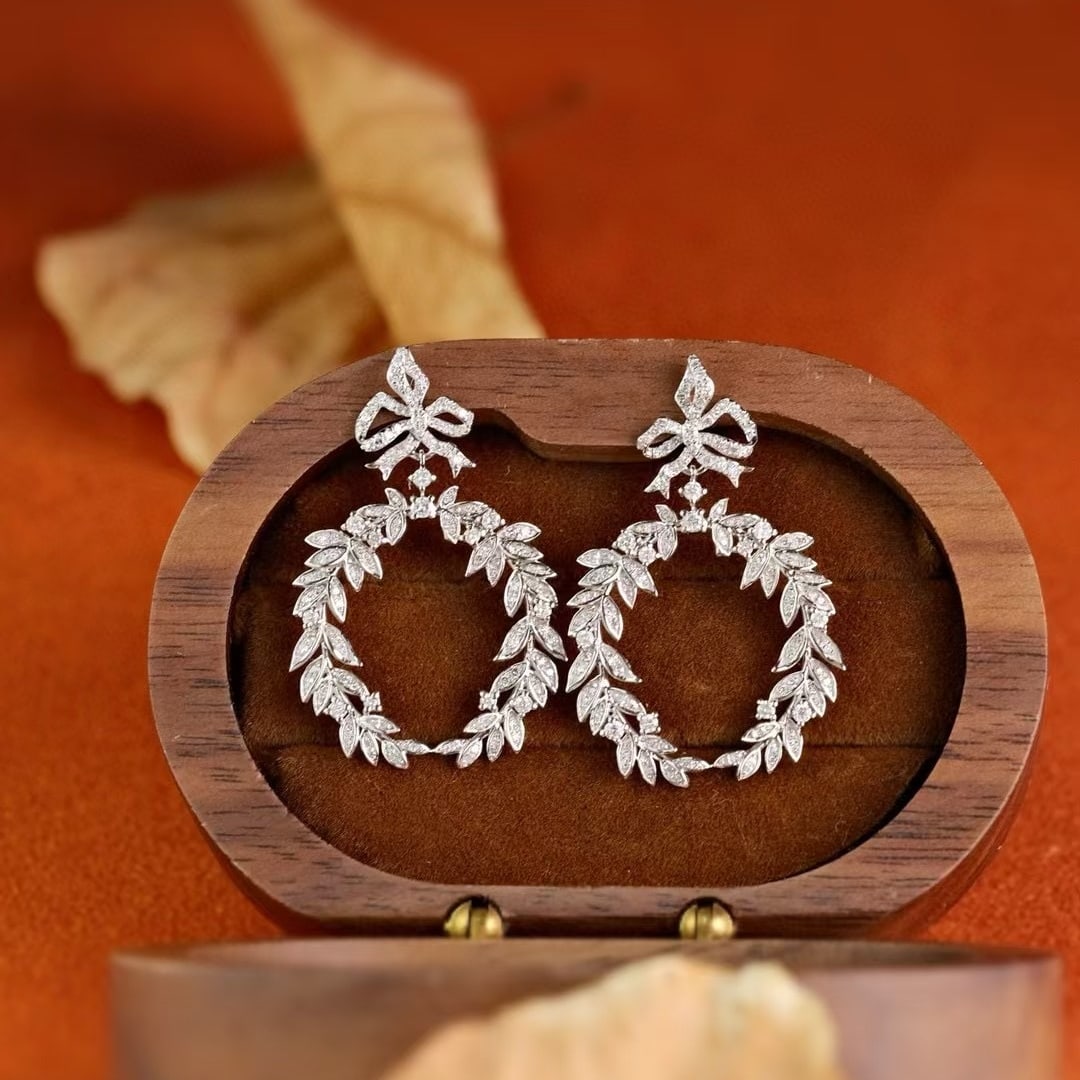 14k Gold 1.1 Ct Natural H Diamond Earrings: Ref:231145049 // gold content:14k gold // main gemstone:diamond // shape:round // carat weight:1. 1ct // clarity grade:vs-si // color:h // treatment:natural // cut grade:g // Low Estimate: