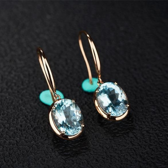 14k Gold 3.76 Ct Natural Aquamarine Earrings: Ref:231145068 // gold content:14k gold // main gemstone:aquamarine // shape:oval // carat weight:3. 76ct // color:blue // treatment:natural // Low Estimate: 2600High Estimate: 4000Condition: New