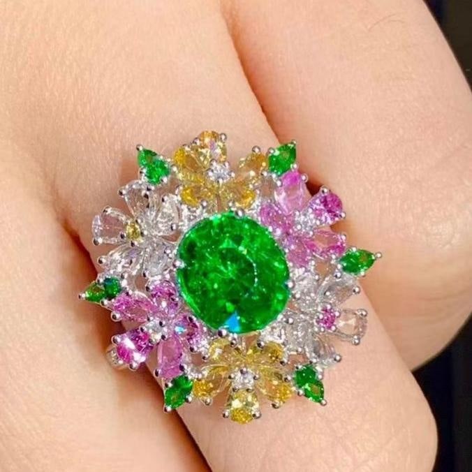 14k Gold 2.01 Ct Natural Tsavorite & Diamond Ring: Ref:231145149 // gold content:14k gold // ring size:7. 25us // // main gemstone:tsavorite // shape:oval // carat weight:2. 01ct // color:green // treatment:natural // // adjacent gemstone 2 :