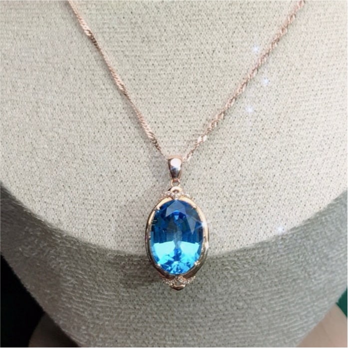 14k Gold 9.75 Ctw Natural Topaz & Diamond Pendant( Without Chain ): Ref:231145158 // gold content:14k gold // main gemstone:topaz // shape:oval // carat weight:9. 7ct // color:blue // treatment:natural // // adjacent gemstone 2 : diamond // number of stones:18 //
