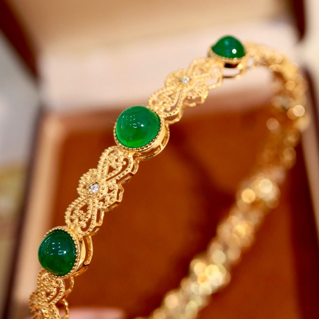 14k Gold 8.24 Ctw Natural Emerald & Diamond Bangle: Ref:231145236 // gold content:14k gold // main gemstone:emerald // shape:round // carat weight:8. 2ct // color:green // treatment:natural // cut grade:g // // adjacent gemstone 2 : diamond //