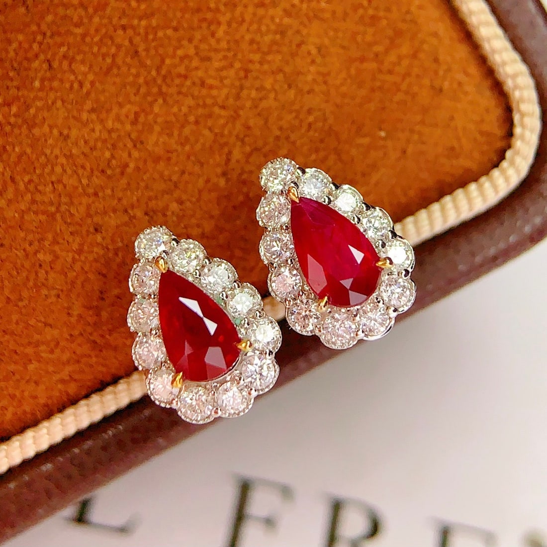 14k Gold 1.5 Ct Natural Ruby & Diamond Earrings: Ref:231146082 // gold content:14k gold // main gemstone:ruby // shape:pear // carat weight:1. 5ct // color:red // treatment:natural // // adjacent gemstone 2 : diamond // number of stones:24 // shape: