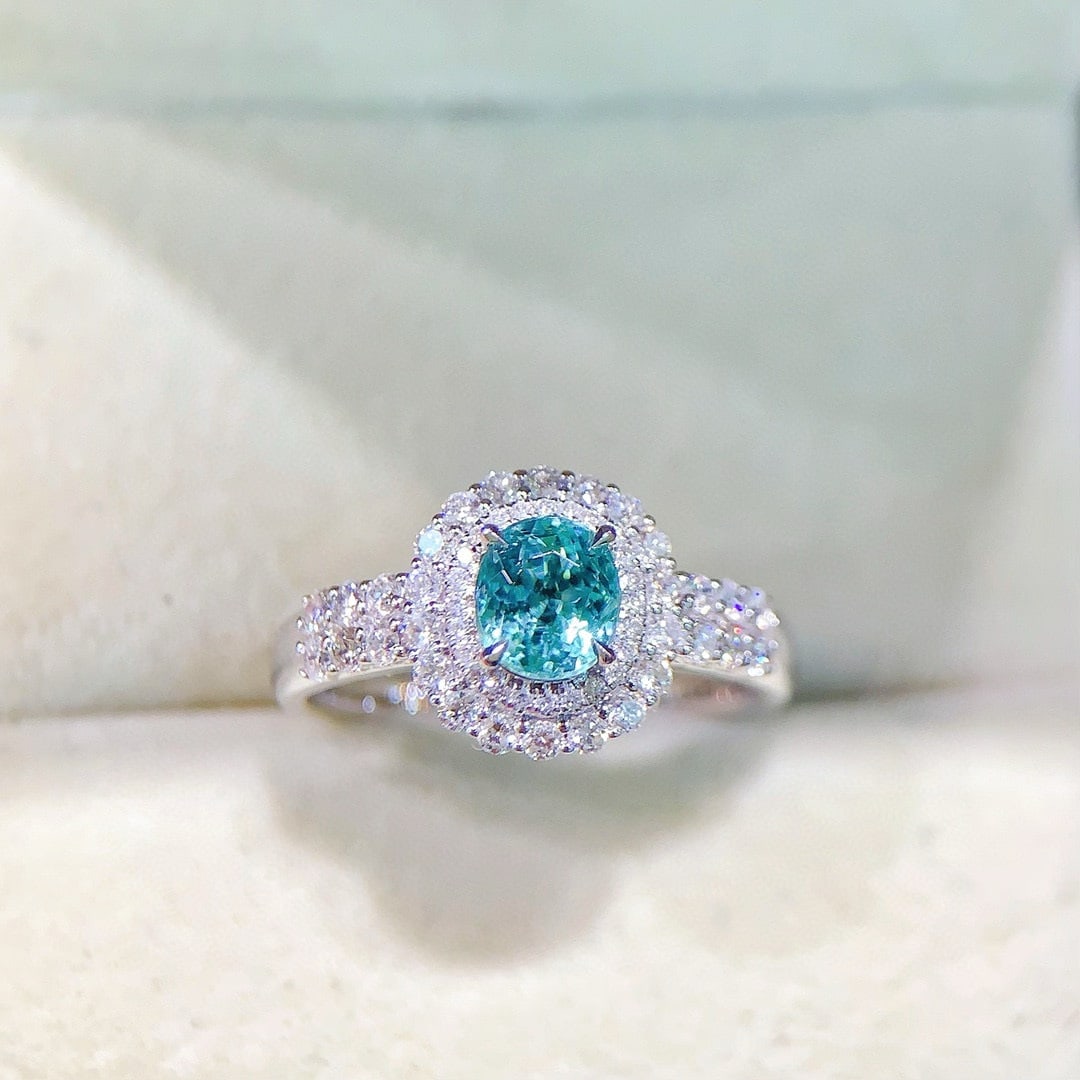 14k Gold 1.62 Ctw Natural Paraiba Tourmaline & Diamond Ring: Ref:230973114 // gold content:14k gold // ring size:7. 25us // // main gemstone:paraiba tourmaline // shape:oval // carat weight:1ct // color:bluish green // treatment:natural // // adjacent gemstone