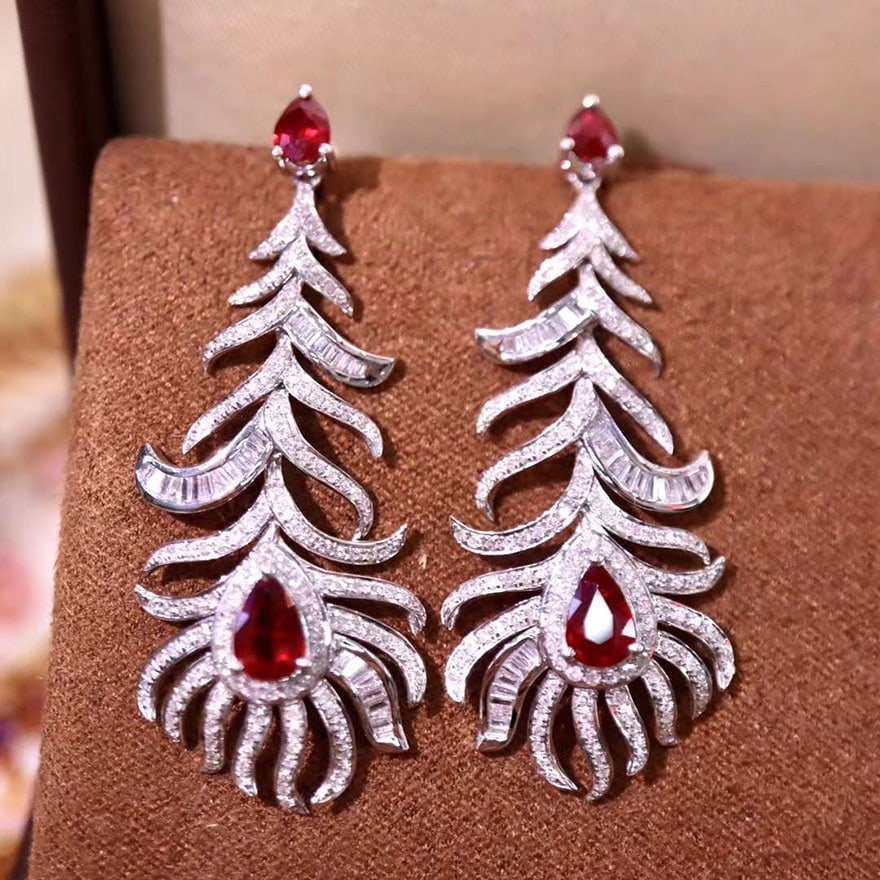 14k Gold 3.13 Ctw Natural Ruby & Diamond Earrings: Ref:230974113 // gold content:14k gold // main gemstone:ruby // shape:pear // carat weight:1. 58ct // color:pigeonblood red // treatment:natural // // adjacent gemstone 2 : diamond // shape:multiply /